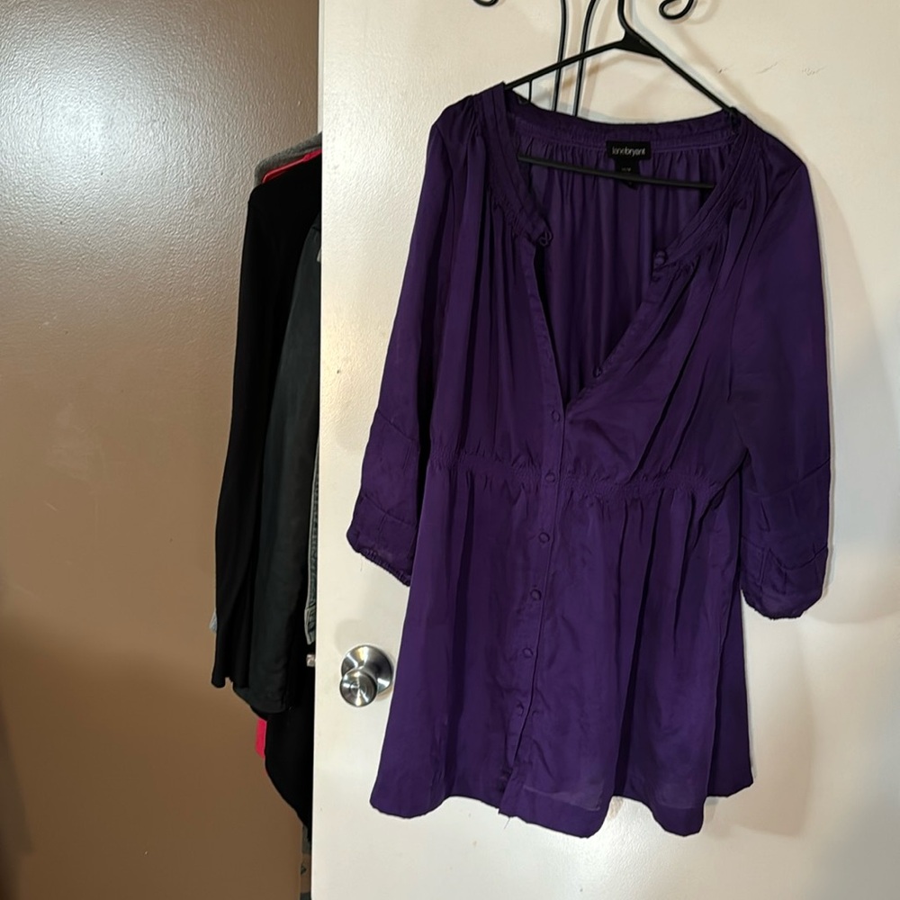 Purple button up top cinched at waist. Longer blouse. Looks nice with leggings
